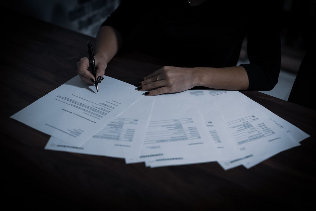A woman filling out tax paperwork