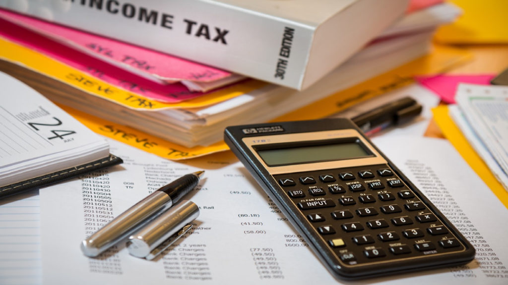tax books, papers, and a calculator