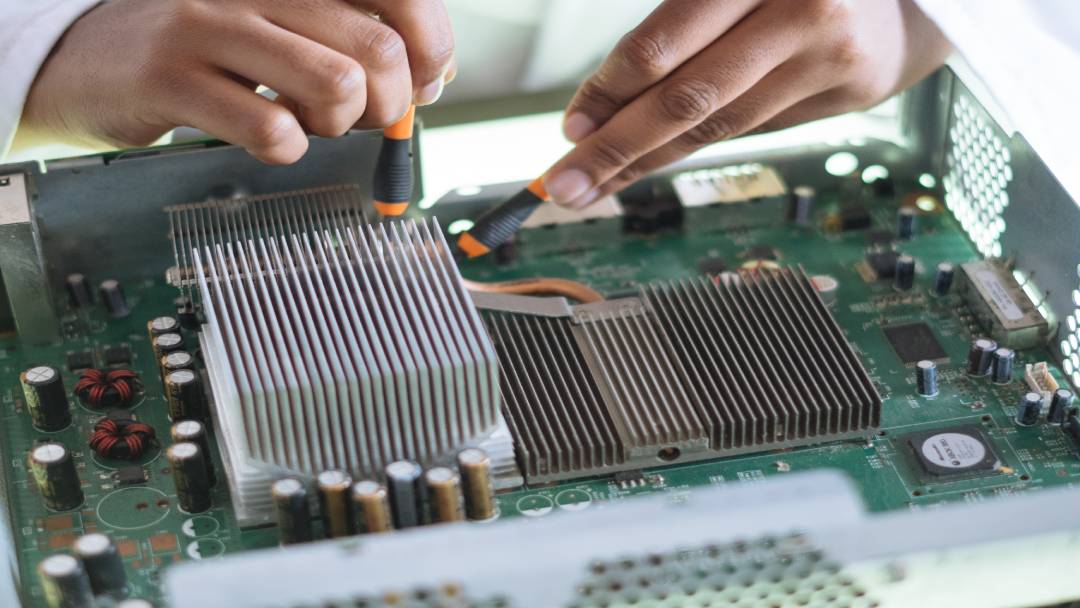 Person looking at a motherboard