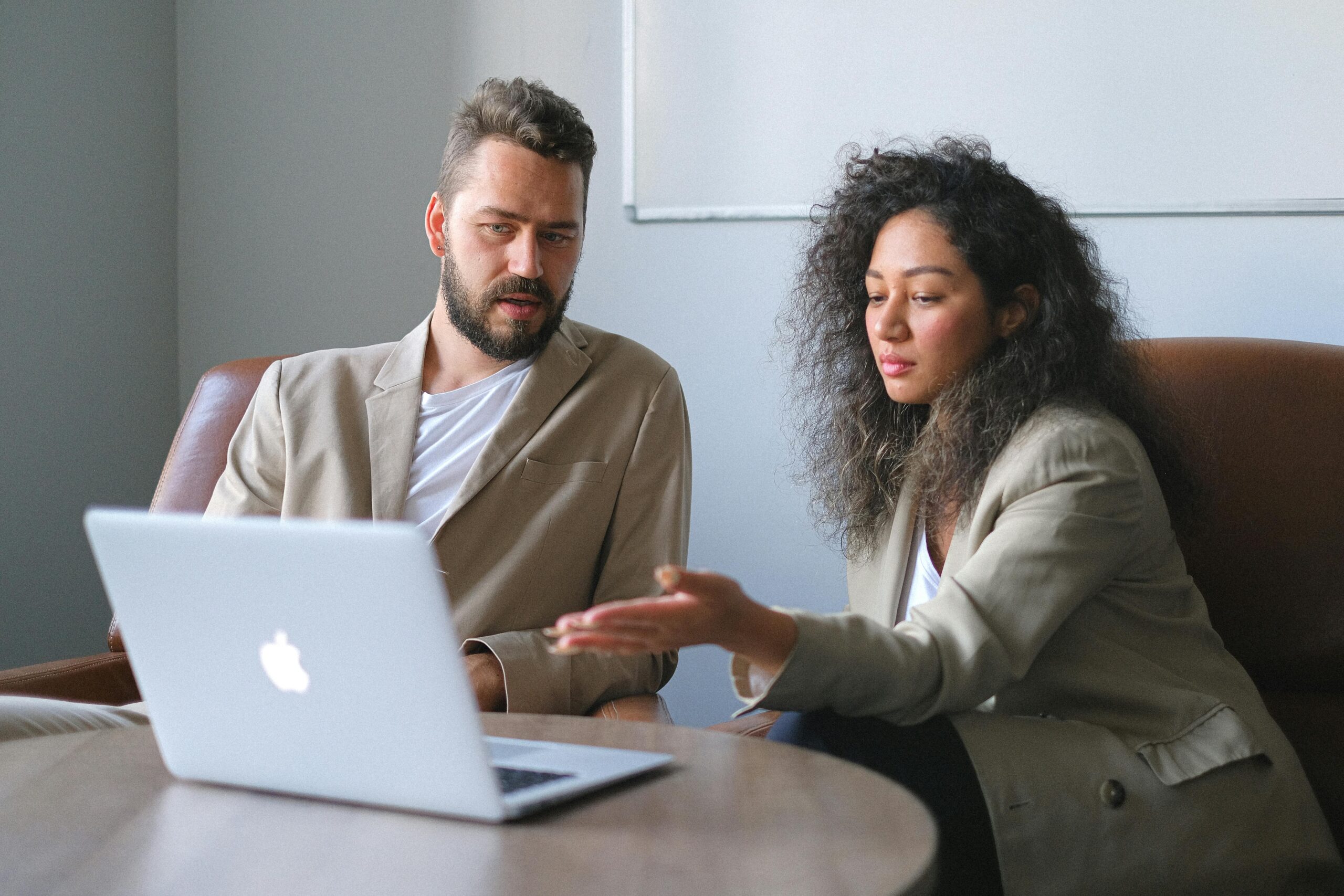 Small business owner analyzing reports as part of cash flow management strategies.